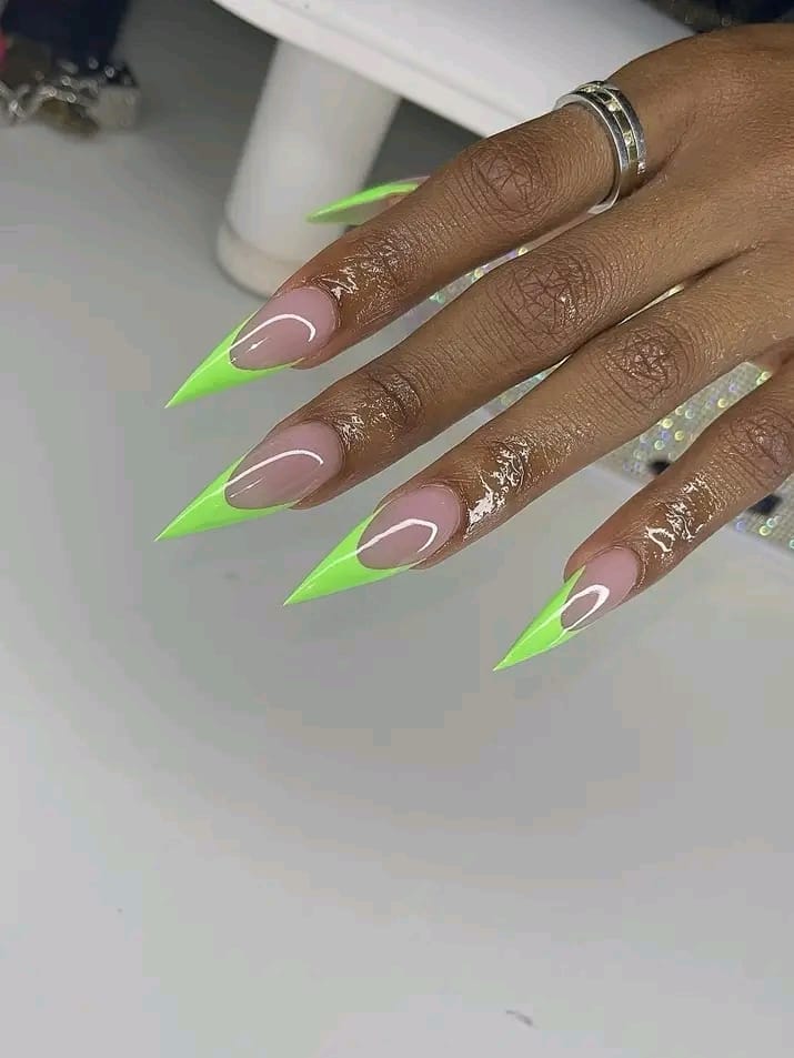 Neon green stiletto nail set on full hand