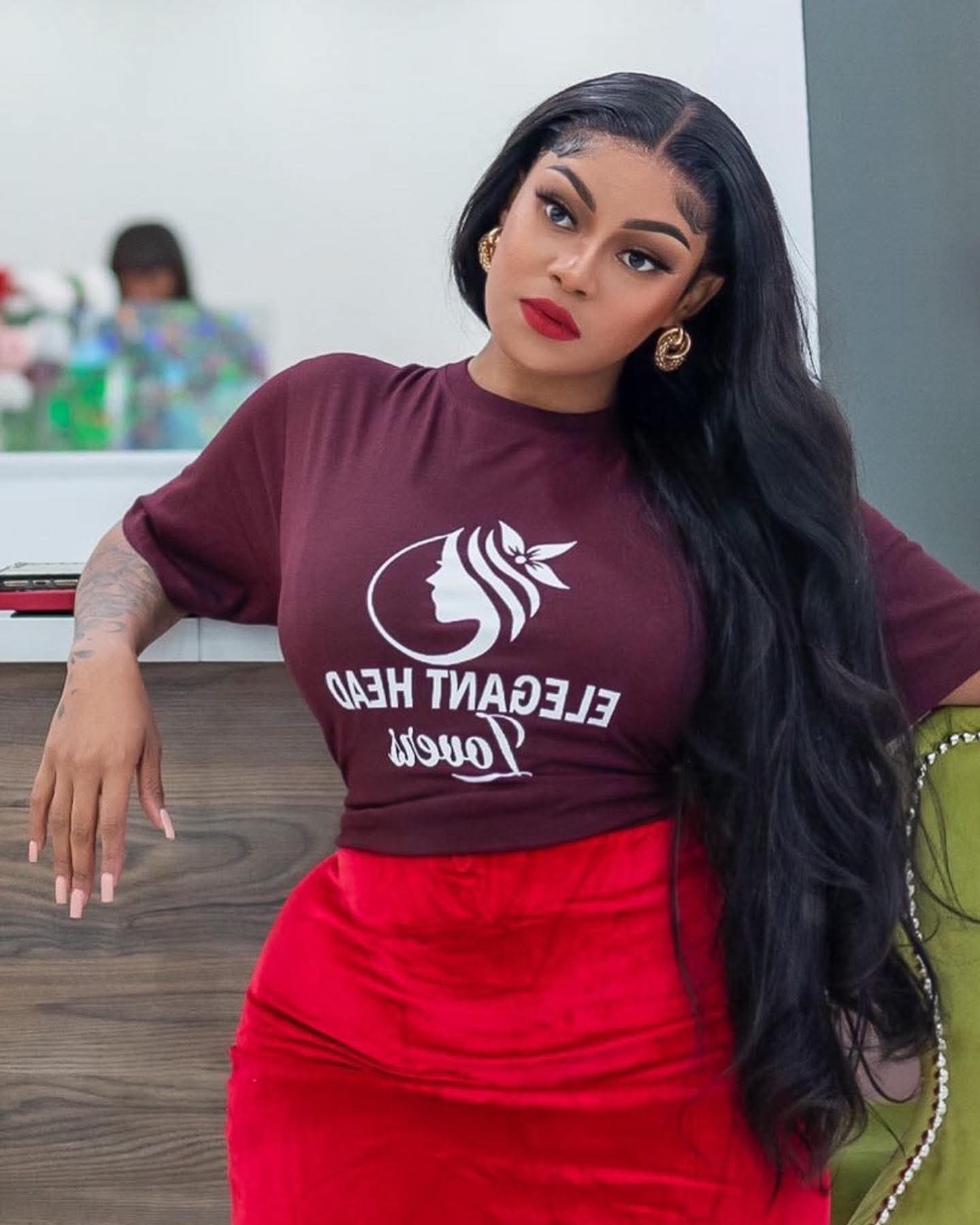 Client wearing a long jet black wig install at the salon