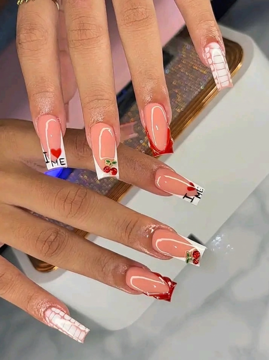 Long square acrylic nails with cherry and heart nail art