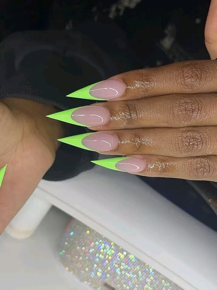 Neon green French tip stiletto acrylic nails