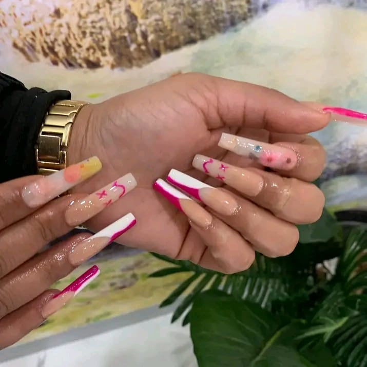 Pink and white French tip coffin nails with smiley art